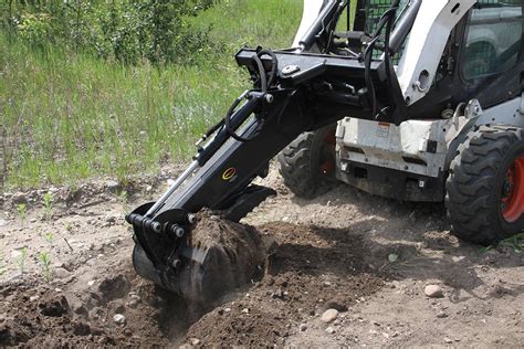 can you dig a hole with a skid steer|skid steer attachments.